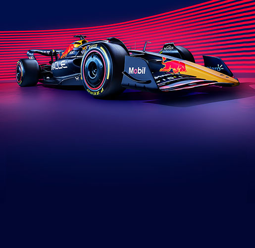 An Oracle Red Bull Racing Formula One race car sitting in front of a magenta and purple pinstriped background.